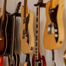 Electric guitars hanging on a studio wall