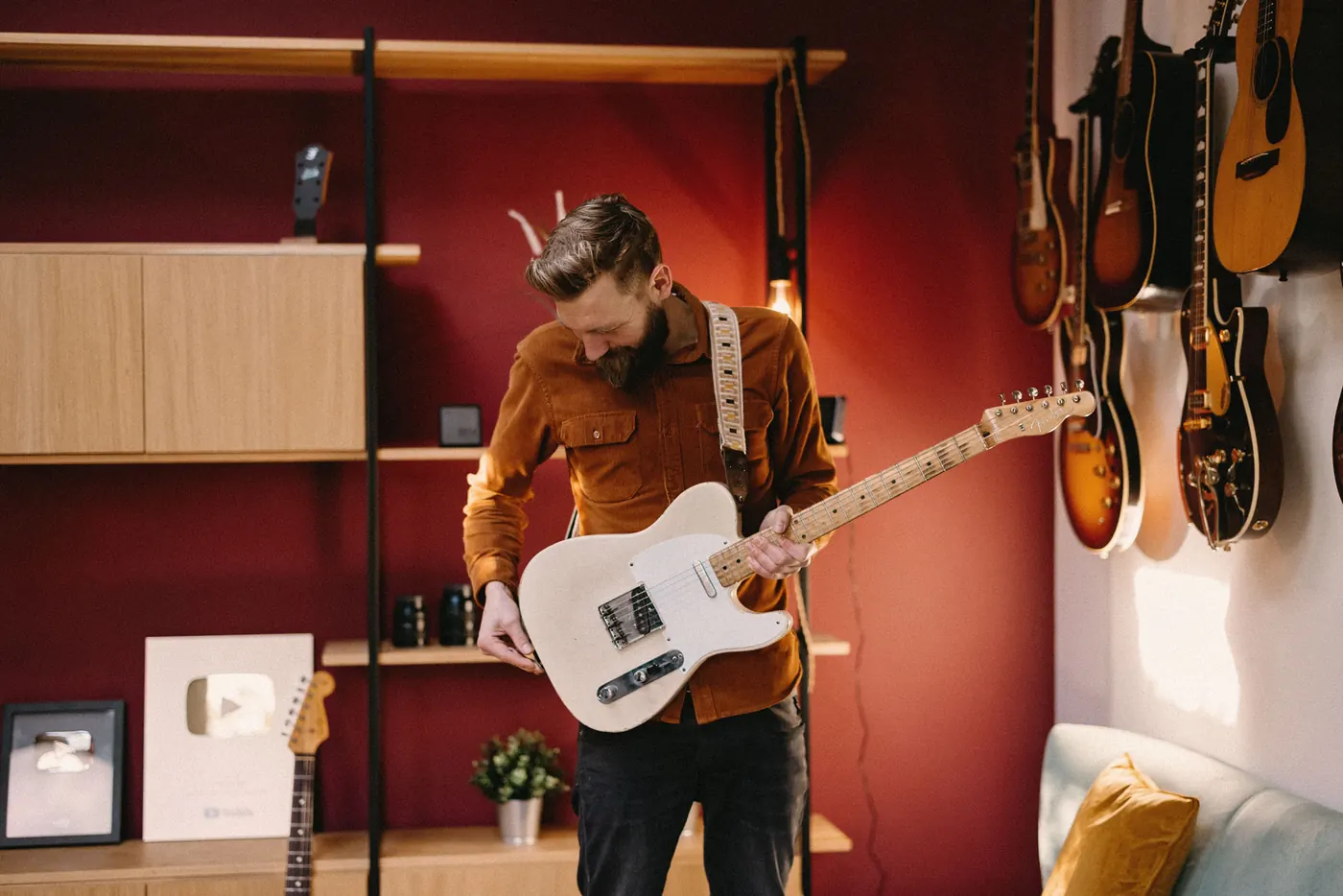Paul Davids holding a guitar.