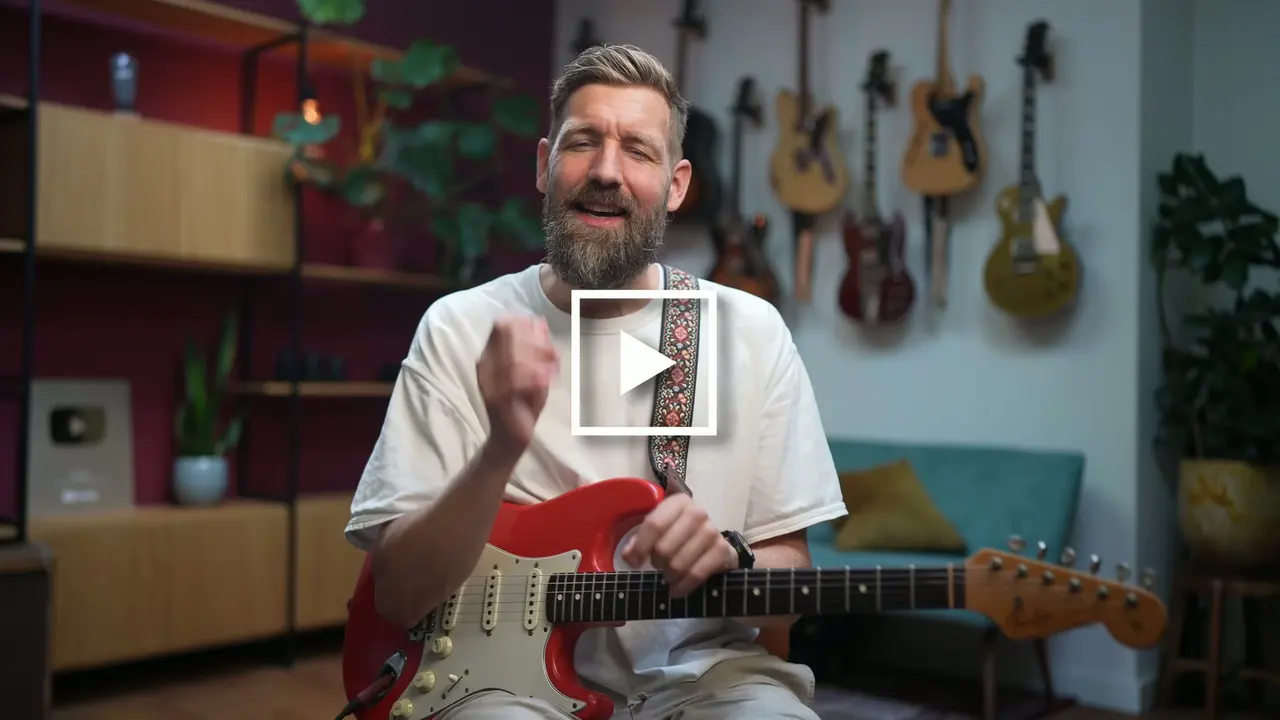 Paul Davids playing guitar.